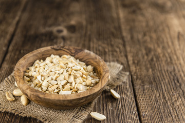 Some chopped Peanuts (close-up shot; selective focus)