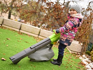 girl with leaf blower