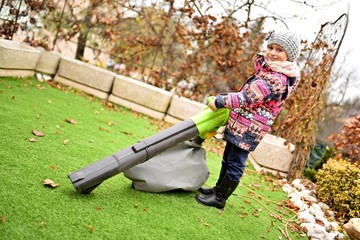 girl with leaf blower