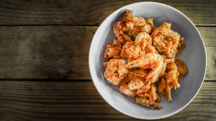Fried prawn balls,deep fried shrimp with sweet sauce on wooden table.