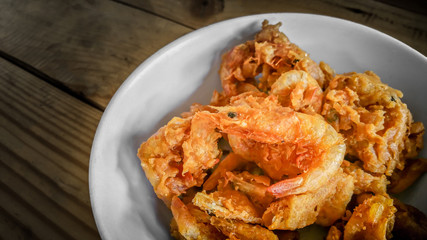 Fried prawn balls,deep fried shrimp with sweet sauce on wooden table.