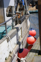 Fishing boat with round bumpers, anchored in Yaquina Bay, Newport, Oregon Coast