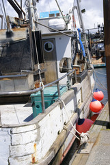 Fishing boat with round bumpers, anchored in Yaquina Bay, Newport, Oregon Coast