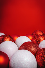 red and white baubles on red background