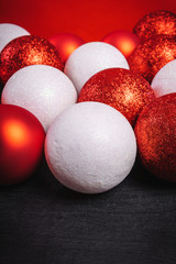 red and white baubles on a black wooden table