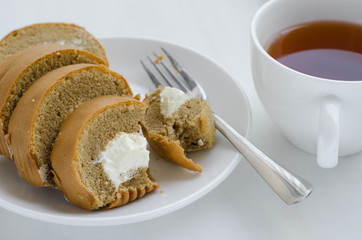 Coffee Cake Roll with A Cup of Tea On Tea Breaking Time.