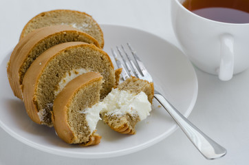 Coffee Cake Roll with A Cup of Tea On Tea Breaking Time.