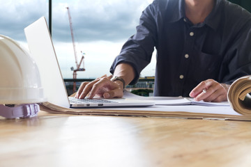 Young man working on his plane project at temporarily officr nea