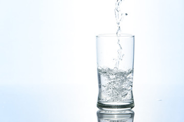 Pouring water in glass