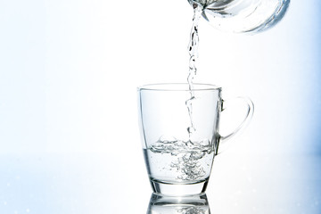 Pouring water in glass