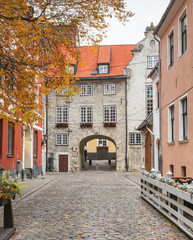 Fototapeta na wymiar Swedish gate is a famous medieval architectural ensemble in old Riga - the capital and largest city of Latvia, a major cultural, historical and tourist center of the Baltic region
