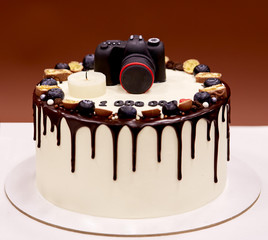 Photographers birthday cake with a photo camera on top