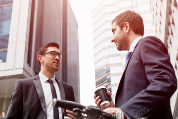 Young businessmen with a bike