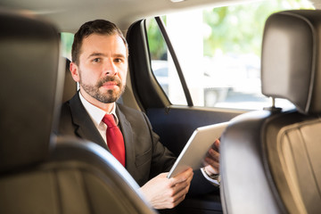 Fototapeta na wymiar Latin businessman in a car ride