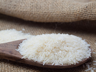 Closeup, rice on white , Placed on a wooden spoon