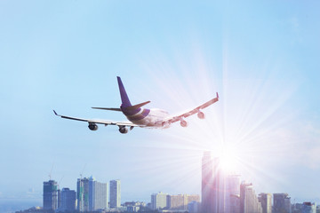 Fototapeta na wymiar Travel by air transport - Passenger plane is landing away from airport