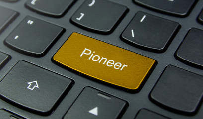 Business Concept: Close-up the Pioneer button on the keyboard and have Gold, Yellow color button isolate black keyboard