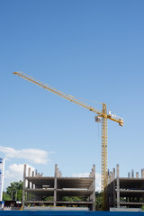Industrial construction cranes with blue sky