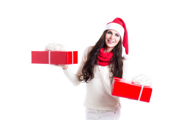 Beautiful woman in santa hat holding two gifts. Concept of the New Year sales. New Year bonus.