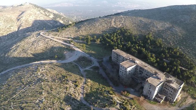 Aerial view of an old abandoned building on the mountain.