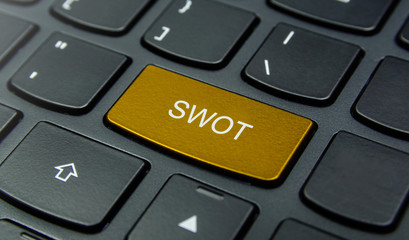 Business Concept: Close-up the SWOT Strengths, Weaknesses, Opportunities, Threats button on the keyboard and have Gold, Yellow color button isolate black keyboard