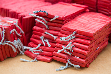 Red firecrackers on brown background
