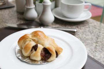dessert baked or fruit bread on white dish.