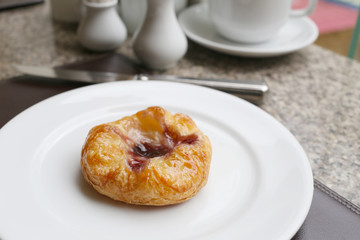 dessert baked or fruit bread on white dish.