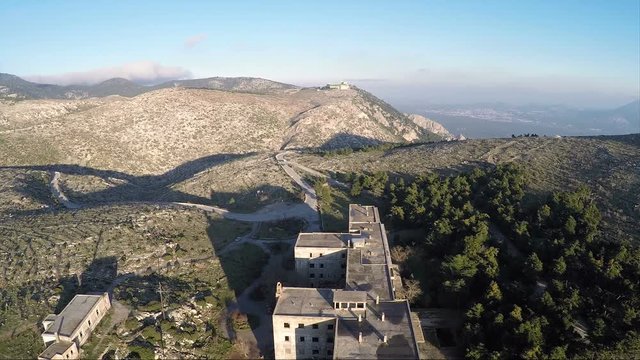 Aerial view of an old abandoned building on the mountain.