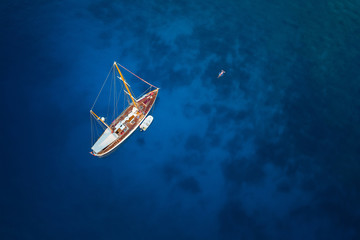 amazing view to yacht and clear water at sunrise - caribbean paradise