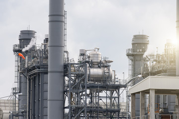 Industrial power plant with smokestack