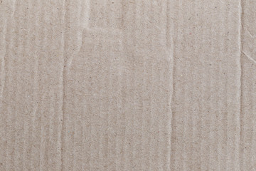 Texture of the brown paper box or cardboard.
