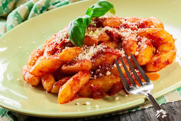 Italian gnocchi with tomato sauce and cheese