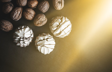 Many walnuts on a black background. Place for text. Autumn. Sunlight