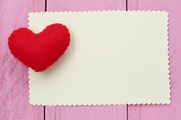 Red heart placed on paper note of empty for input text or messag