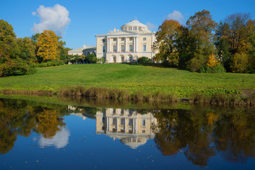 Fototapeta na wymiar Pavlovsk Palace and its reflection sunny October afternoon. Pavlovsk, Saint-Petersburg. Russia