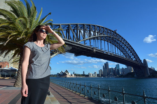 Woman traveller watch the sunset from Sydney Harbour Bridge