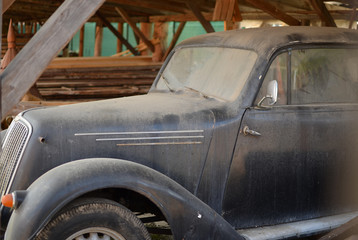 Old veteran car parked in the barn