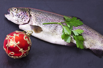 Trout on the plate with holiday decoration