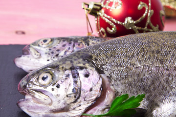 Trout on the plate with holiday decoration