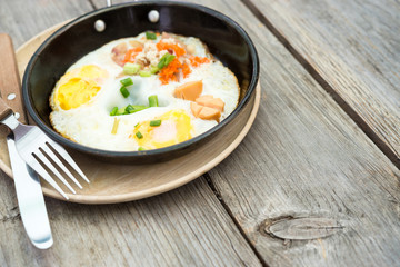 pan egg on wooden table, breakfast