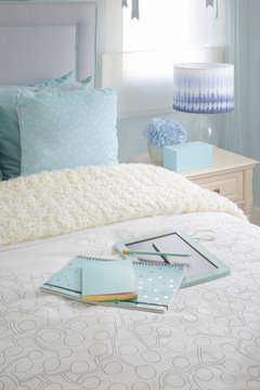 Blue Color Notebook On Bed In Light Blue Color Scheme Bedroom Interior