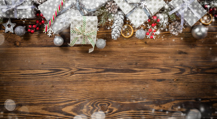 Christmas gift boxes placed on wooden planks