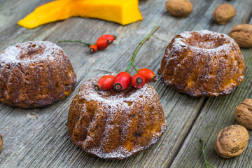 Three Pumpkin cakes with walnut, rose hip and autumn leaves