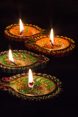Colorful candle for diwali celebration on black background