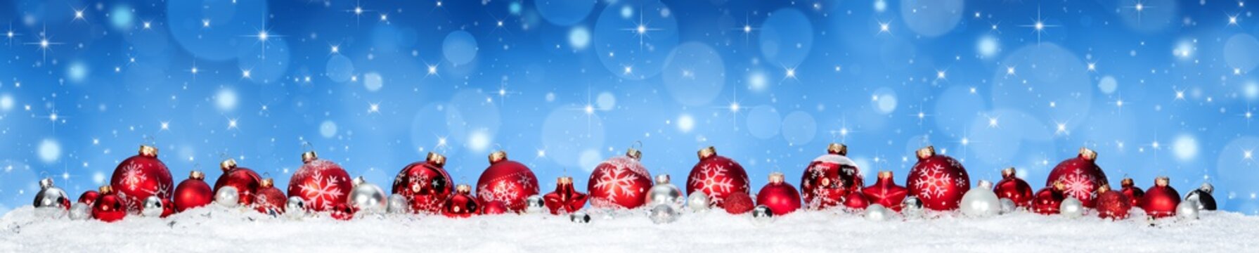 Red Baubles On Snow Whit Snowfall and Blue Heaven - Christmas Banner
