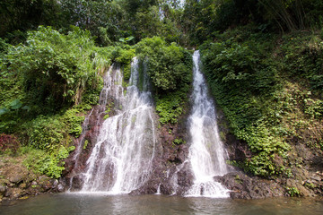 Fototapeta na wymiar Air Terjun, waterfall near banyuwangi in Java island, Indonesia