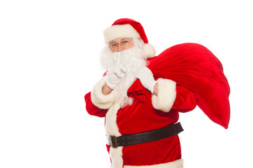 real Santa Claus carrying big bag and showing ok, isolated on white background Christmas