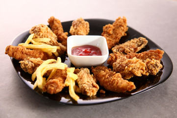Grilled chicken on a plate standing the wooden table