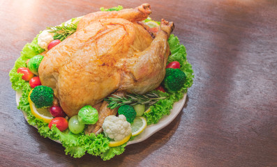 Roasted turkey stuffing garnished with Vegetables served with gravy sauce on a rustic style table. Christmas Dinner